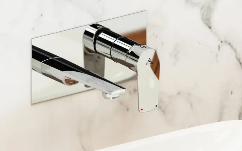 Sleek chrome wall-mounted faucet against a marble background, perfect for luxury and modern bathroom designs.