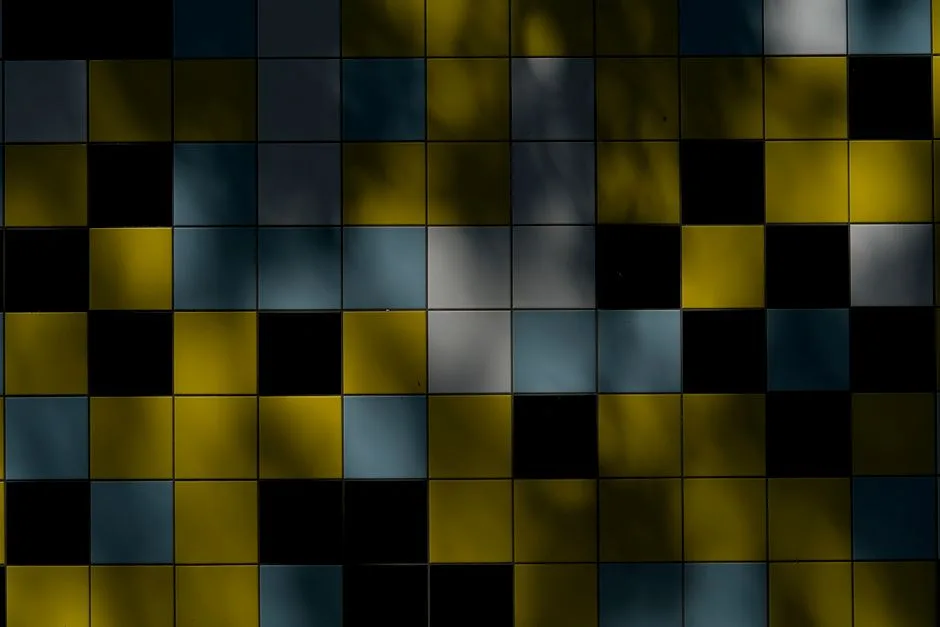 Vibrant tiled wall showcasing bold colors and shadow play, creating an abstract pattern.