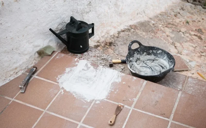 Construction tools and materials on tiled floor, Ciutadella de Menorca, Balearic Islands.