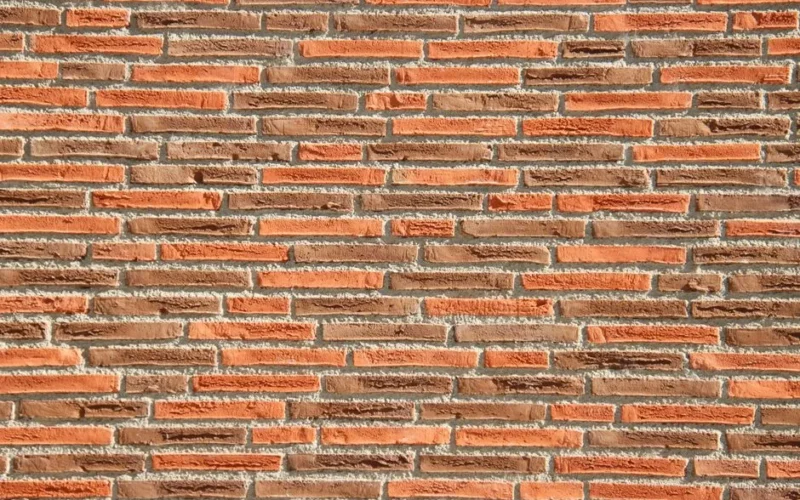 Detailed texture of a red brick wall, perfect for architectural backgrounds.
