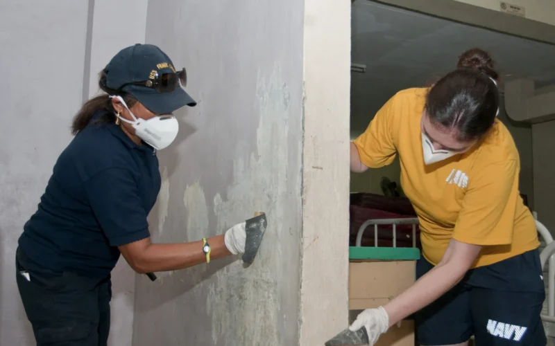 OLONGAPO CITY, Philippines (Sept. 6, 2012) Hospitalman Sharon Tate and civil service mariner (CIVMAR) Maria Giudice, both assigned to the submarine tender USS Frank Cable (AS 40), sand old paint off a wall in the charity wing of the James L. Gordon Hospital. Frank Cable Sailors and CIVMARs spent the day working with members of the hospital staff to paint various rooms and hallways throughout the hospital. Frank Cable conducts maintenance and support of submarines and surface vessels deployed in the U.S. 7th area of responsibility. (U.S. Navy photo by Mass Communication Specialist 2nd Class Corey Hensley/Released) 120906-N-UE250-011 Join the conversation www.facebook.com/USNavy www.twitter.com/USNavy navylive.dodlive.mil