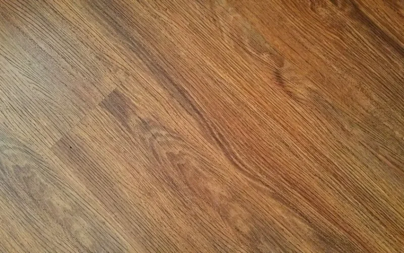 Detailed image of rustic wooden flooring with visible wood grain texture.